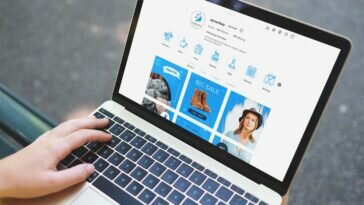 Free Laptop with Hand Mockup